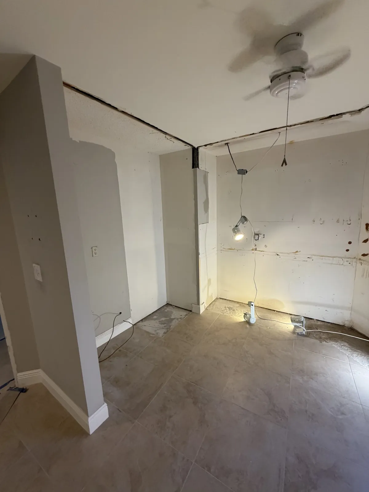 Kitchen after cabinet and appliance removal by Superior Demo & Debris Removal in Broward County FL