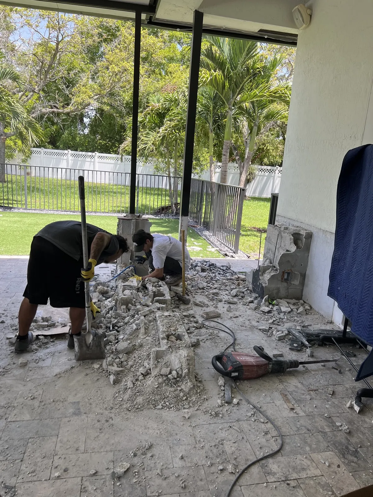 Superior Demo crew demolishing outdoor patio kitchen in Broward County FL